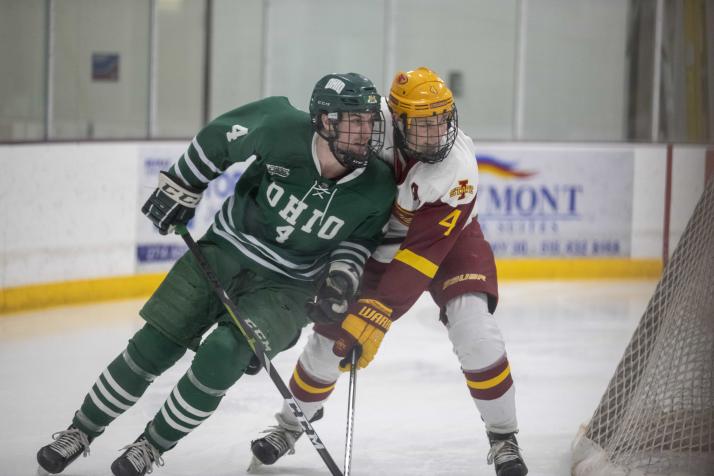 OHIO Hockey player shoulders a rival player during a game