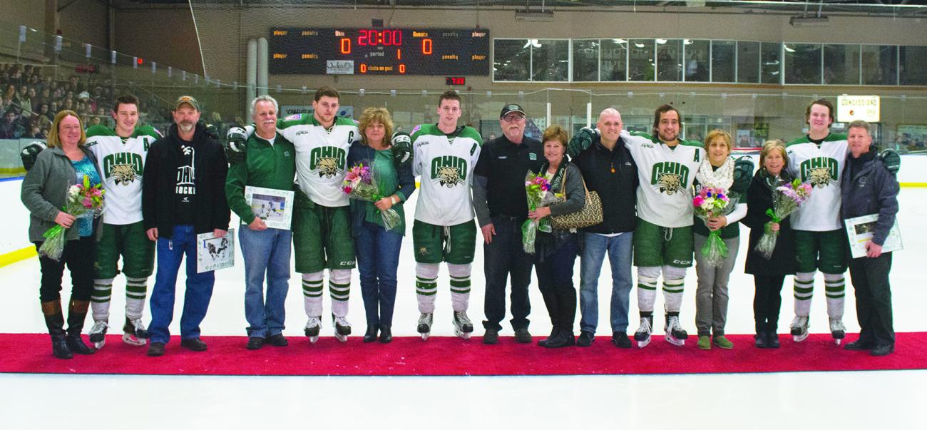 OHIO Hockey players pose on the ice with their families