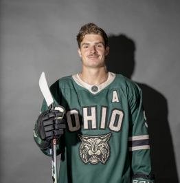 Noah Holt posing in his jersey