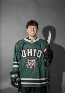 Drake Nabozny posing in his hockey jersey