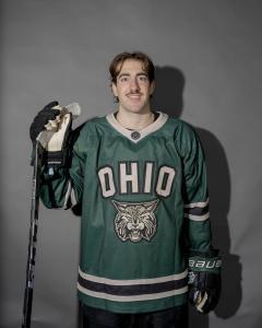Alex Mazuca posing in his hockey jersey